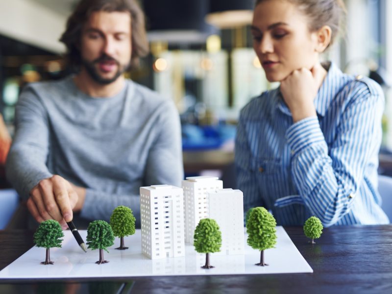 architectural-model-young-adults-architects-background_329181-19759
