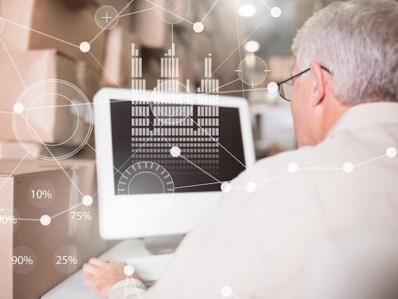 business-overlay-interface-with-elderly-businessman-computer_1134-12276