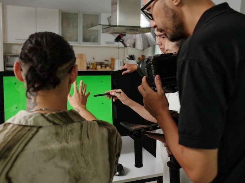 director-making-plan-shooting-with-crew_274689-55664