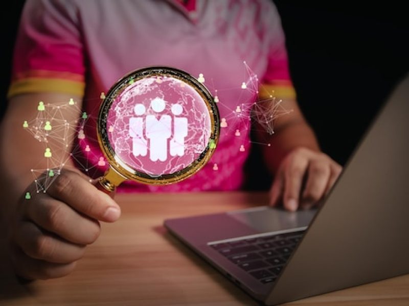 human-resource-management-hrm-concept-businessman-holding-magnifier-searching-human-icons-human-development-recruitment-concept_228338-1094