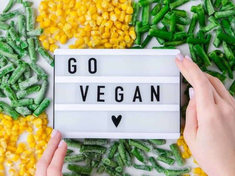 lightbox-with-text-go-vegan-frozen-vegetables-food-yellow-corn-green-beans-colors-traffic_1048944-9052358
