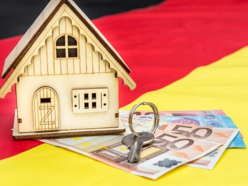 model-house-with-euro-bills-german-flag_547271-5938