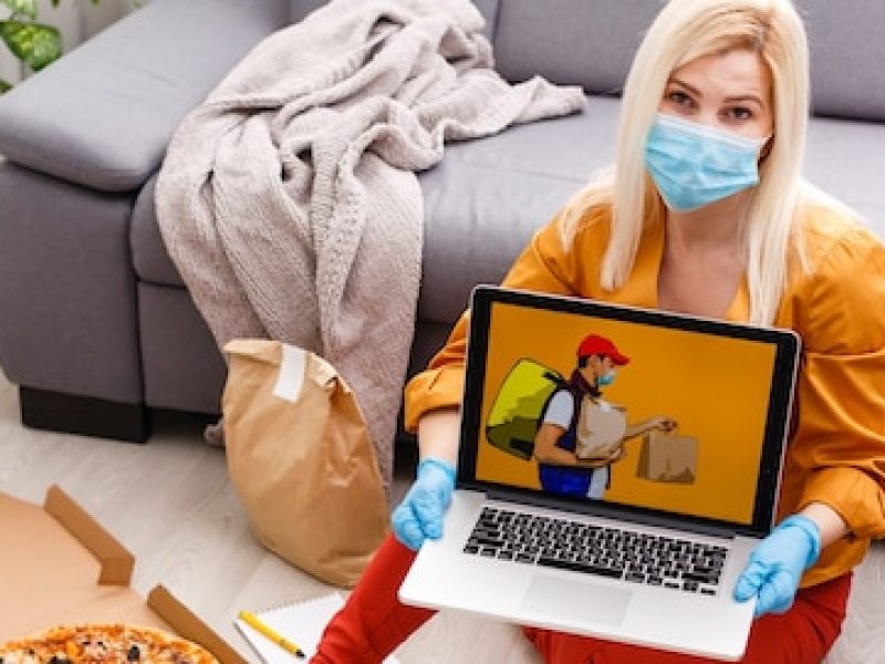 woman-using-laptop-online-food-order-quarantine-closeup-delivery-service_493343-2929