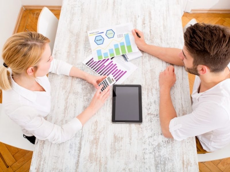 young-couple-organizing-their-financial-situation-home_93826-1444
